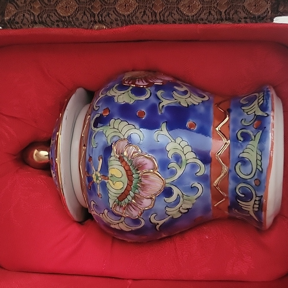 White Ceramic Vase with Red Markings